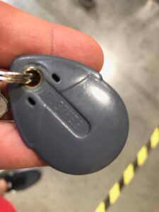 FDI Urmet key with a unique engraved code, designed for precise duplication